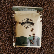 Bubba's Coffee packaging on a bed of coffee beans